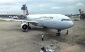 a large white airplane on a runway