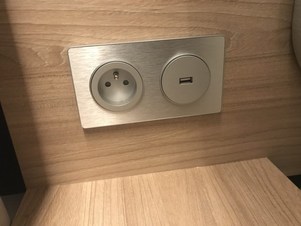a silver outlet with a usb port