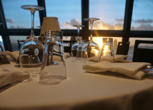 a table with glasses and napkins