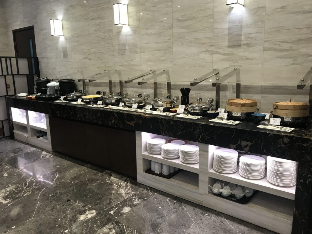 a buffet line with many dishes on it