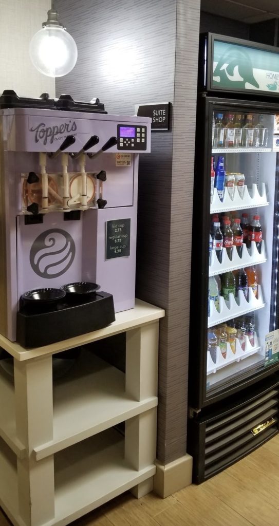 a machine with a display and a drink cooler