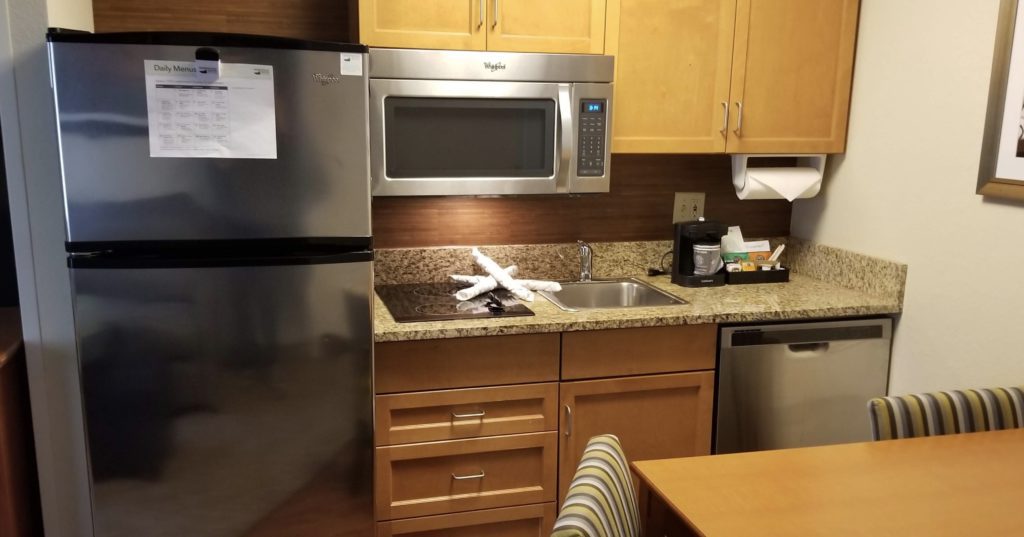 a kitchen with a sink and microwave