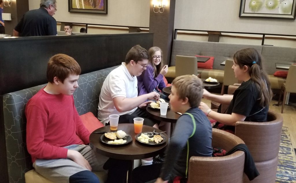 a group of people sitting at a table