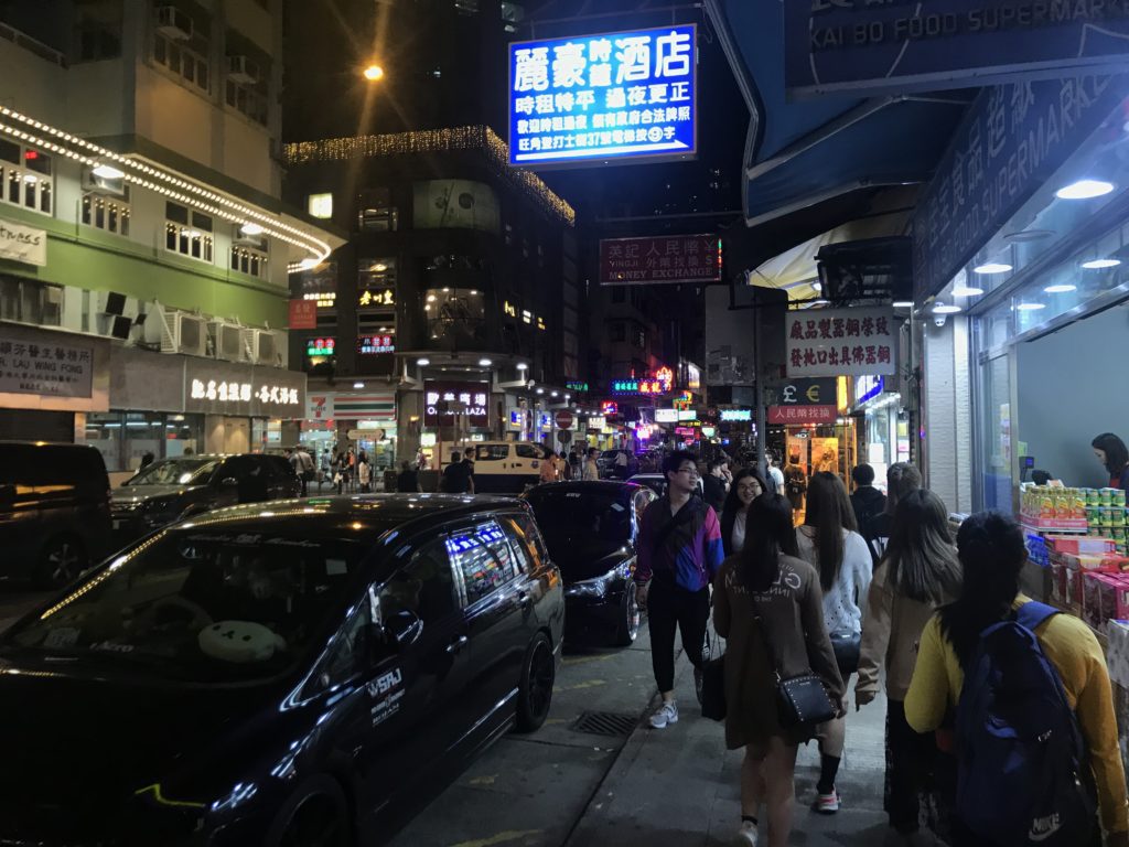 a group of people walking on a street