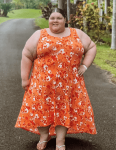 a woman in an orange dress