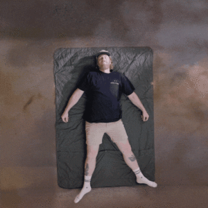 a man lying on a mattress