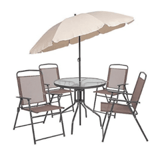 a table and chairs with an umbrella