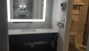 a bathroom sink with a mirror