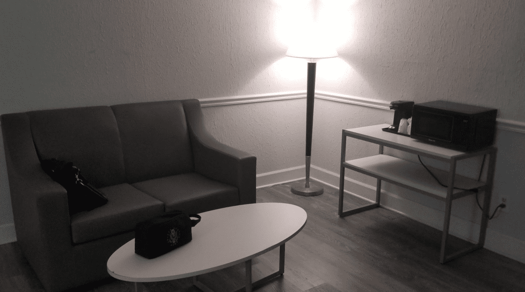 a couch and a lamp in a room