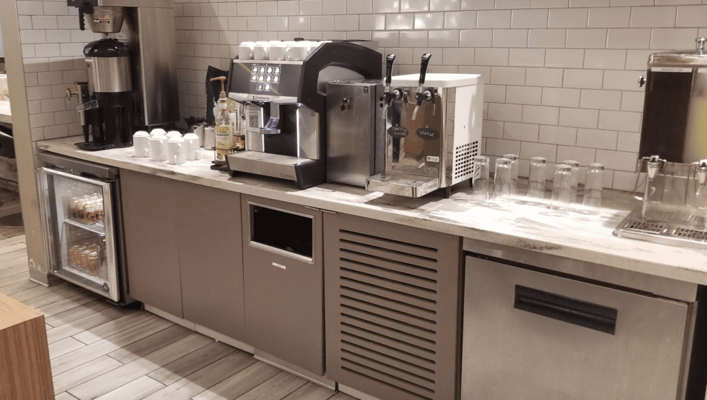 a coffee machine and a dispenser on a counter