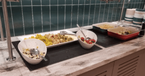 a group of bowls of food on a counter