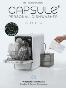 a dishwasher machine with a hand pouring a liquid into it