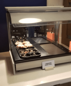 food on a tray in a glass case