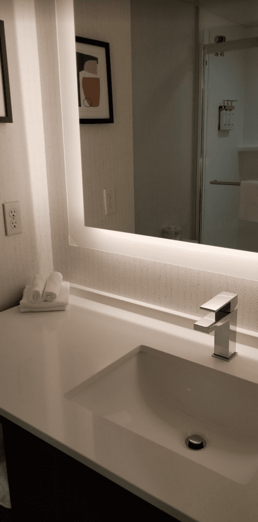 a bathroom sink with a mirror