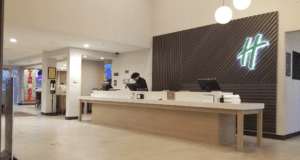 a man working at a reception desk