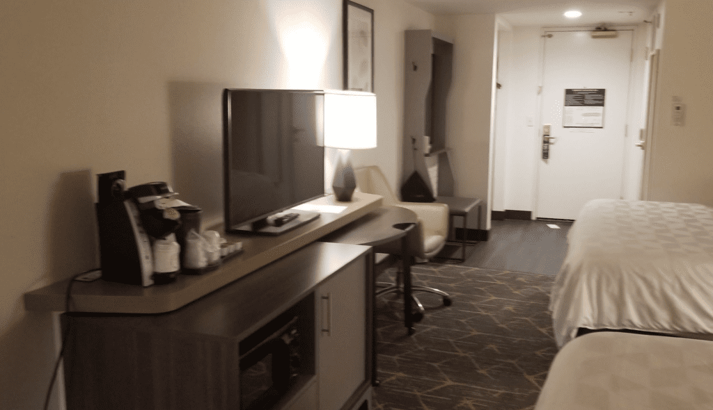 a room with a television and a desk