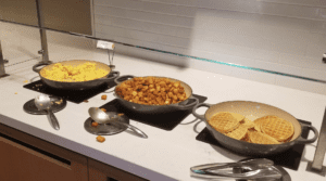 a group of bowls of food on a counter