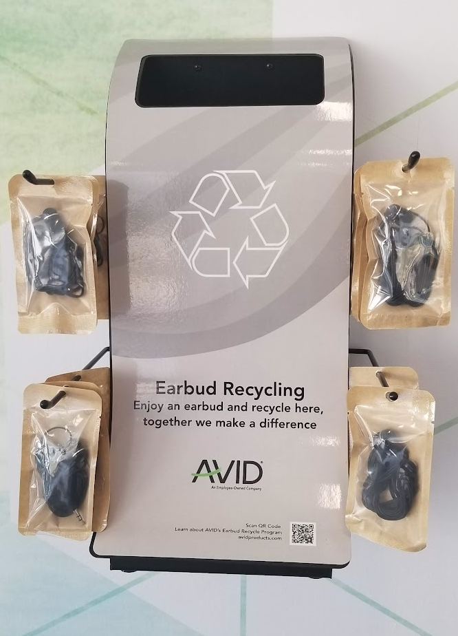 a group of earbuds in packages