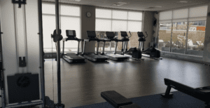 a room with treadmills and exercise equipment