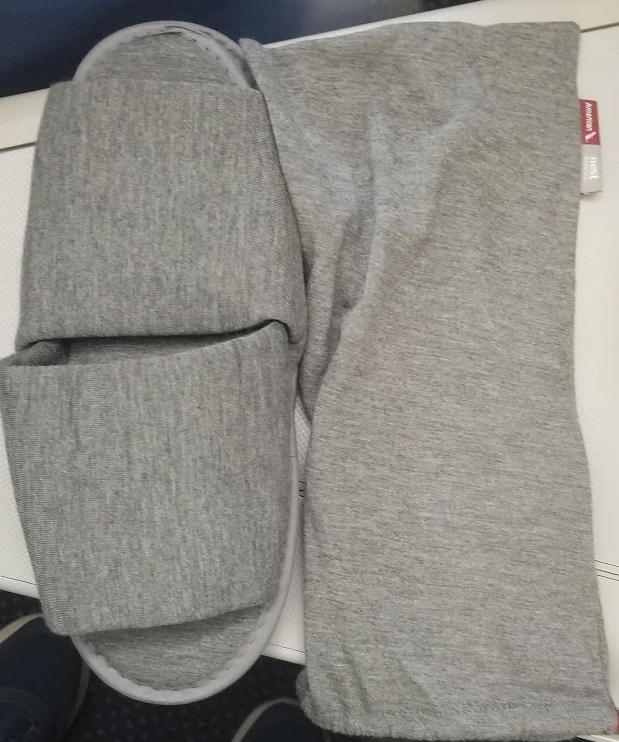 a pair of grey slippers and pants