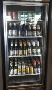 a refrigerator full of beer and cans