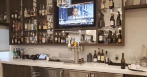 a bar with a television and bottles