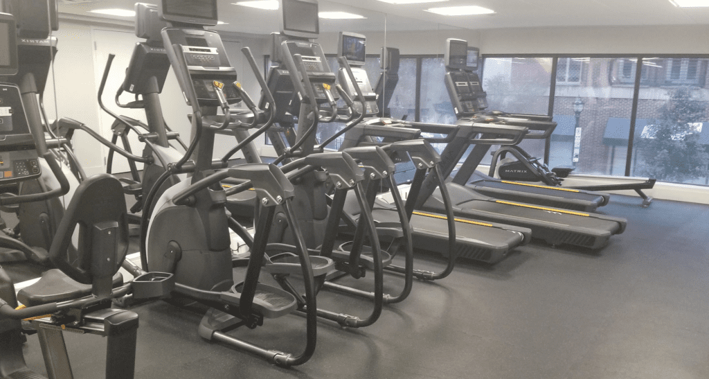 a group of treadmills in a gym