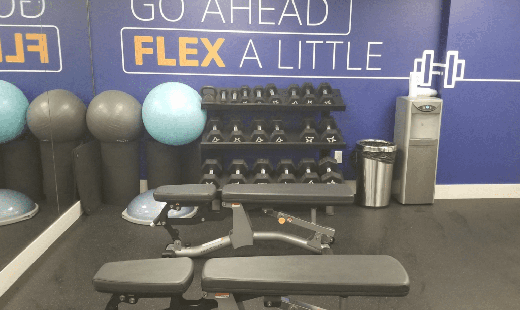 a gym with weights and balls