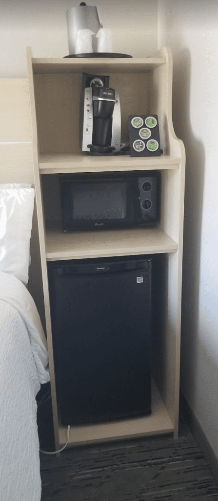 a microwave and mini fridge on a shelf