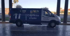 a blue and white van with white text on it