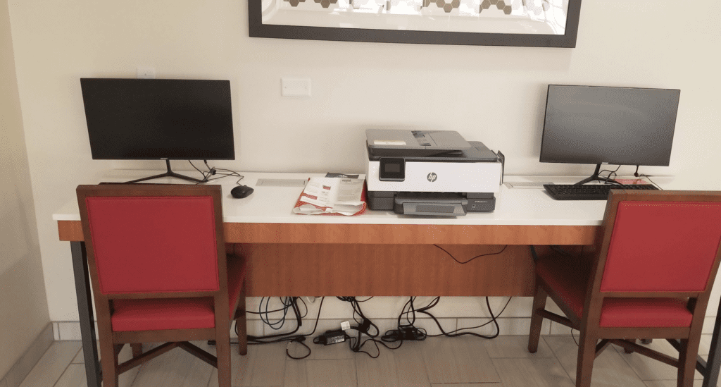 a printer and computer on a desk