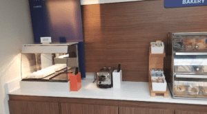 a counter with a toaster and bread in it