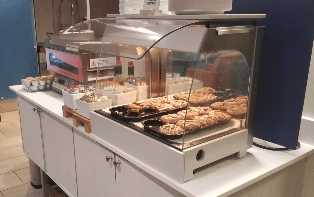 a pastry display case with food on it