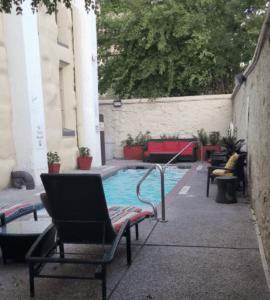 a pool with chairs and a chair attached to it