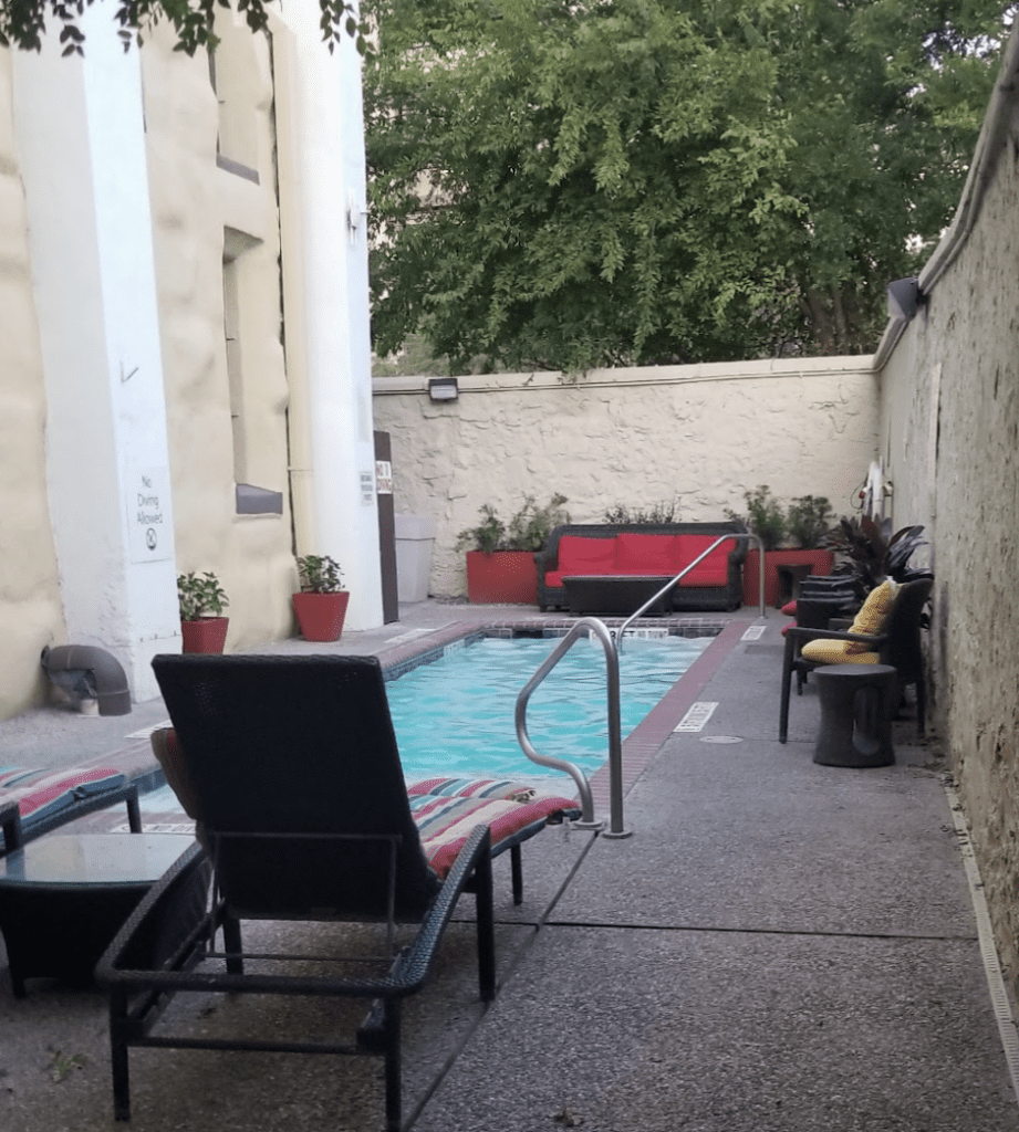 a pool with chairs and a chair attached to it