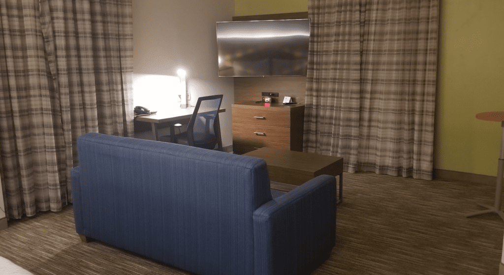 a room with a couch and a desk