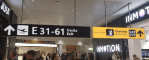 a group of people walking in an airport