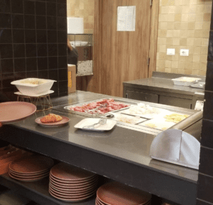 a counter with plates and food on it