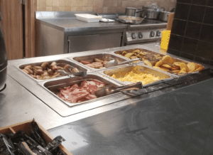 a kitchen with food in containers