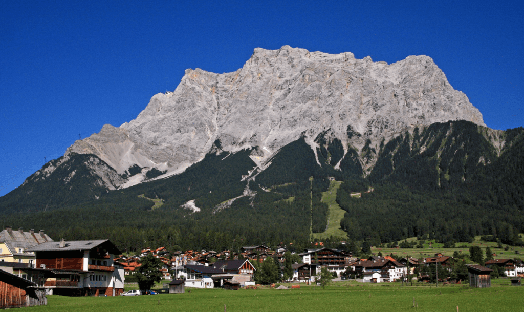 Zugspitze with houses and grass