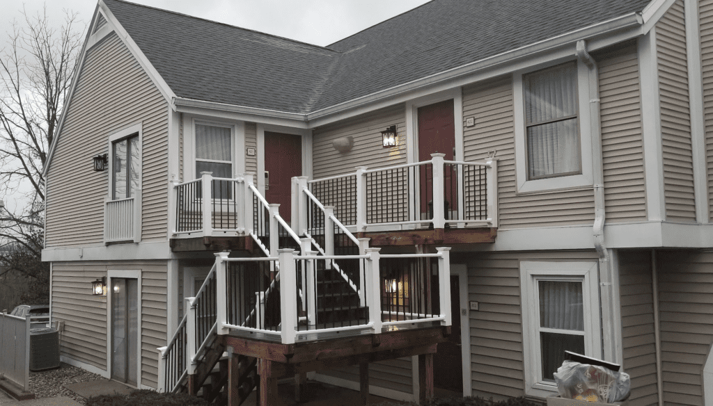 a house with a deck and stairs