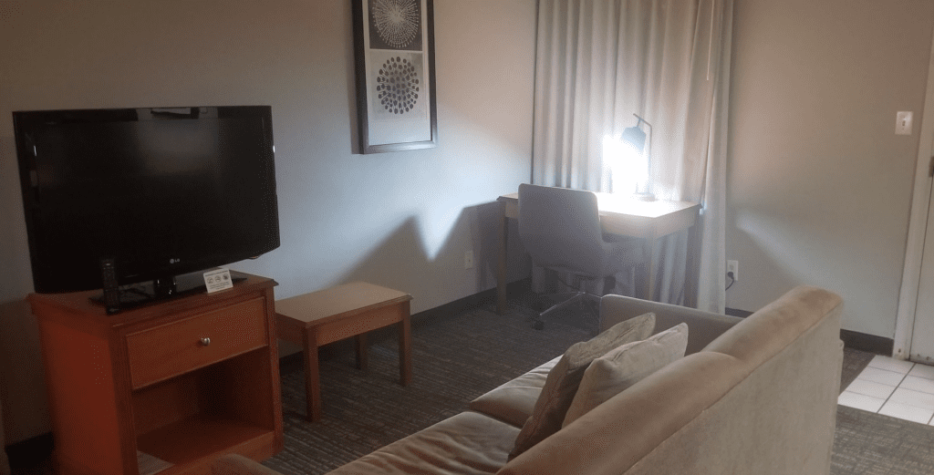 a room with a couch and a desk