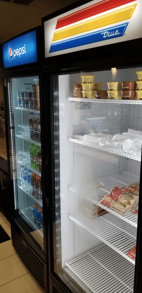 a refrigerator with food on shelves